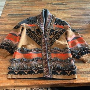Beautiful fringe sweater jacket with special buttons.